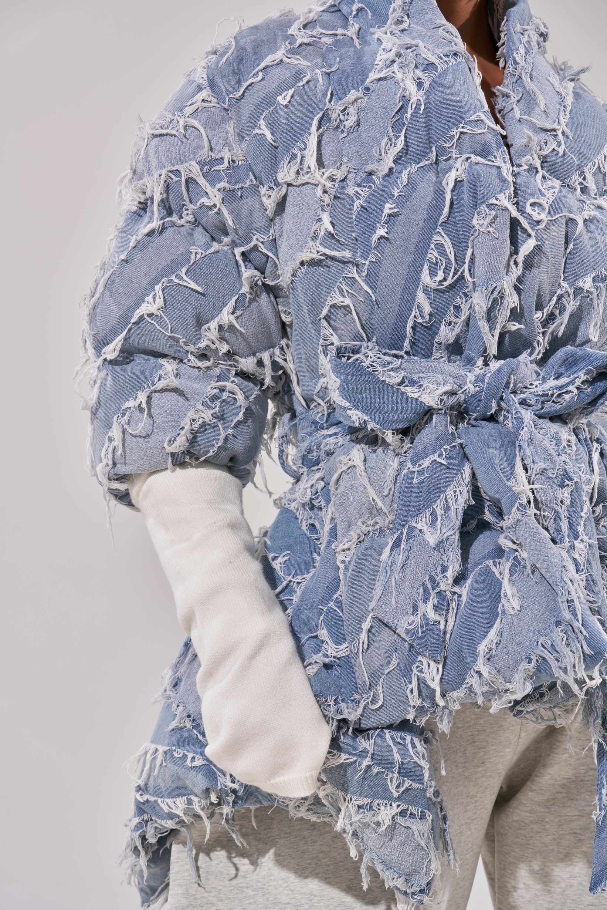 RIB SLEEVE PEPLUM PUFFER IN DENIM