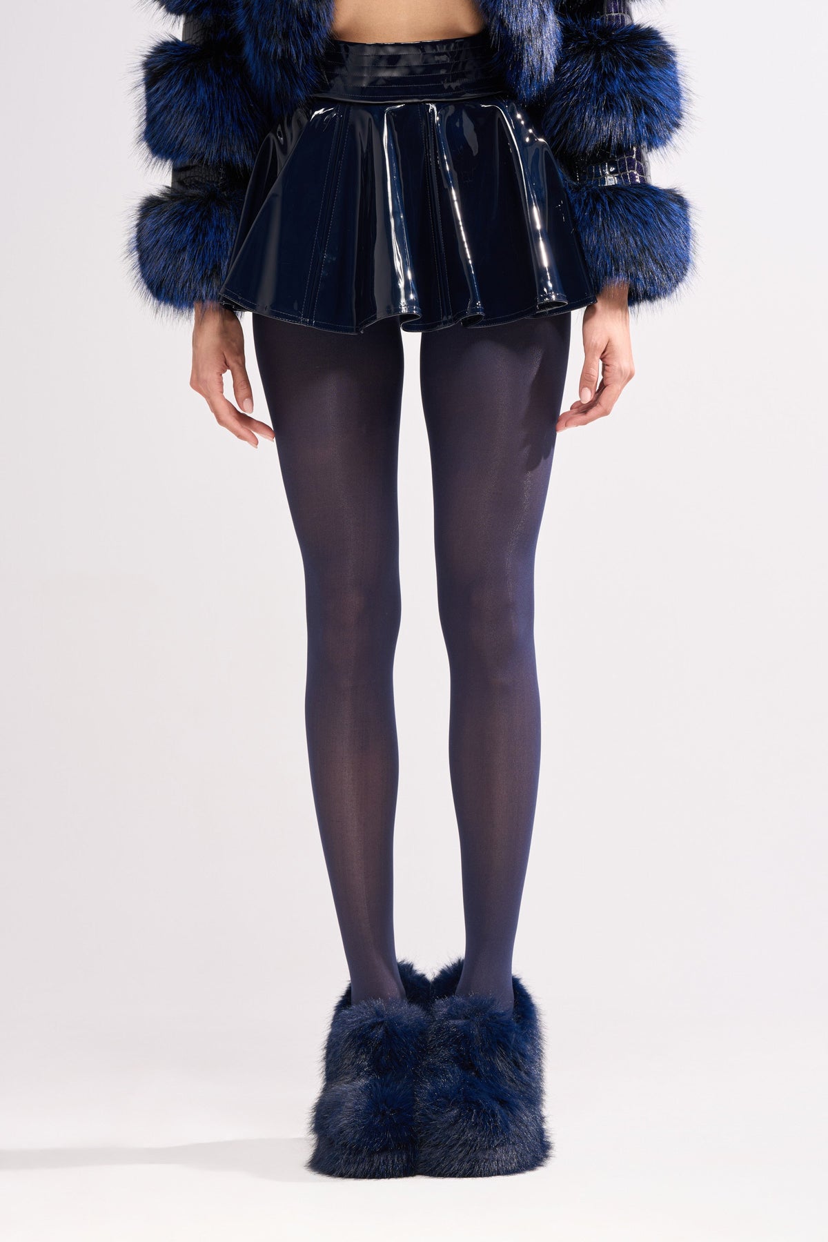 SHE IS ON FIRE FAUX LEATHER MINI SKIRT IN NAVY