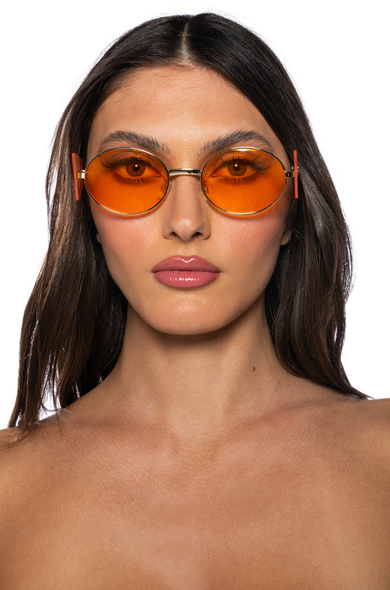 CONTEMPORARY ART RIMLESS SUNNIES IN ORANGE