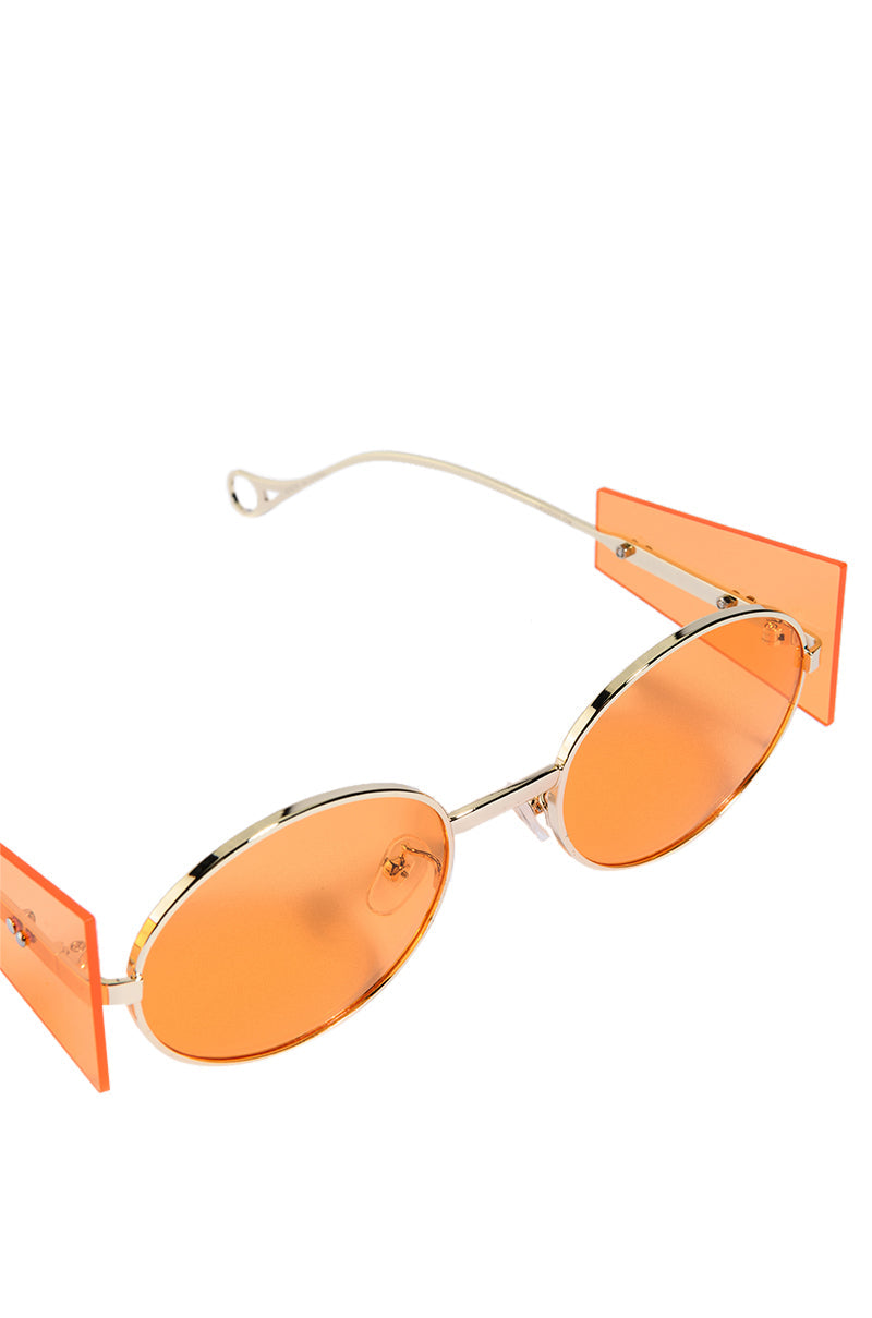 CONTEMPORARY ART RIMLESS SUNNIES IN ORANGE