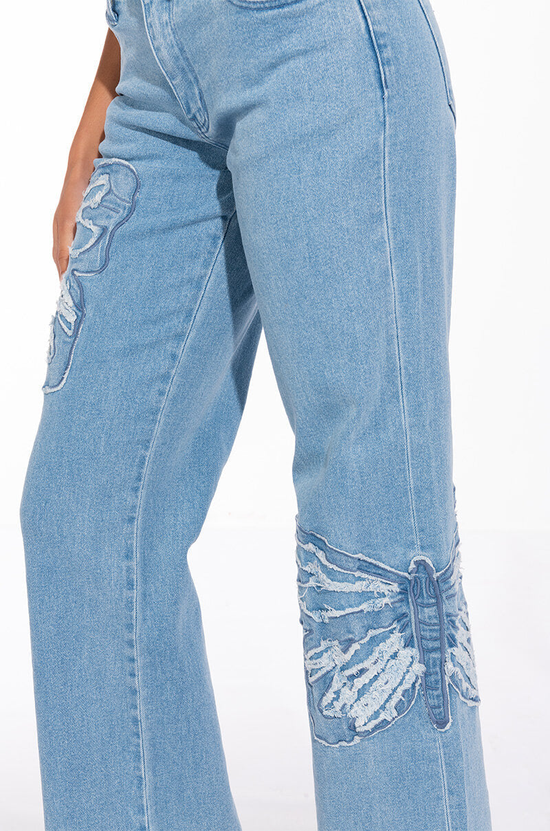 INFINITY BUTTERFLY DETAIL MID RISE WIDE LEG DENIM